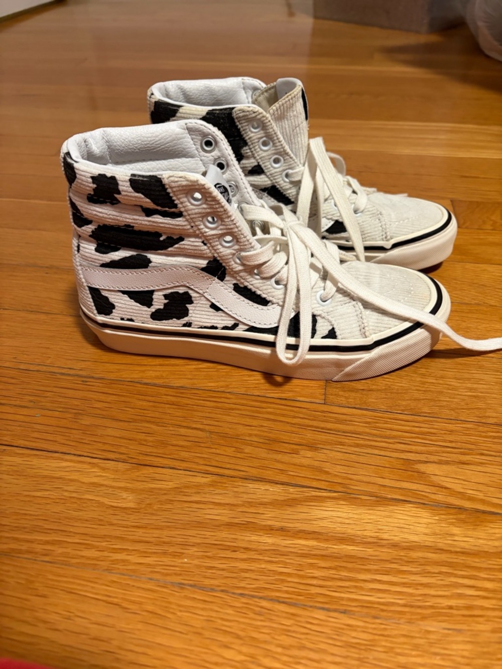 Vans Women’s High-Top Sneakers White with Black Cow Print